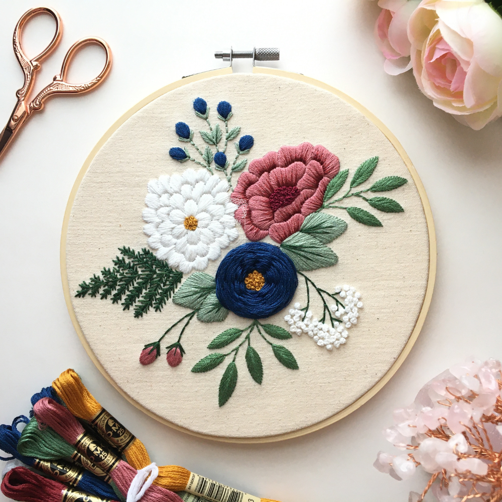 Southern Flowers embroidery kit: pink, navy and white flowers with fern leaves, stitched in a wooden hoop