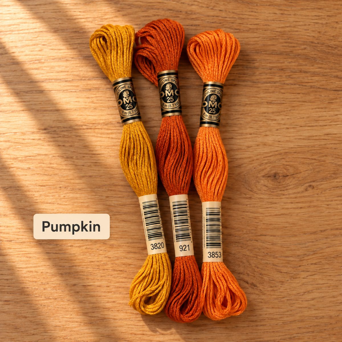 Pumpkin palette: three DMC six-strand embroidery floss skeins