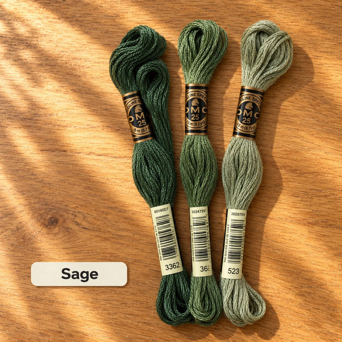 Sage palette: three DMC six-strand embroidery floss skeins