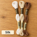 Silk palette: three DMC six-strand embroidery floss skeins